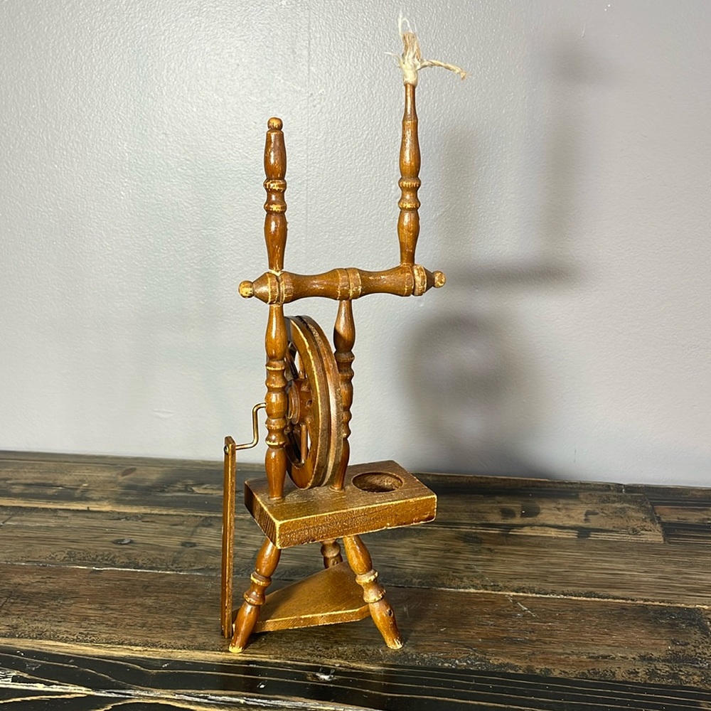 Miniature spinning wheel.  A must for the knitter in your life!  adorable!